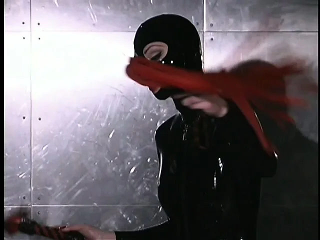 Latex slave and mistress play out their sadistic game in the dungeon